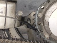 Delivery 
widget, front of sprocket and chain